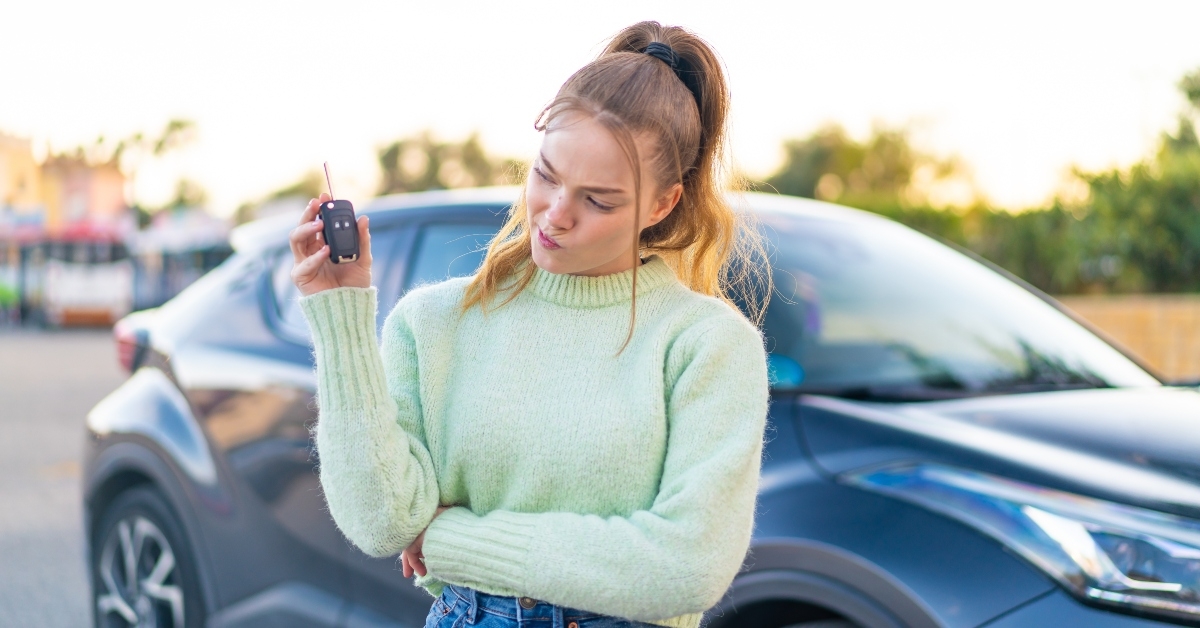 pretty girl holding car key