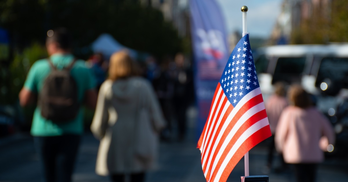 american flag waving in outdoor street
