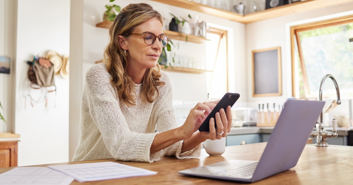 laptop and fintech phone app