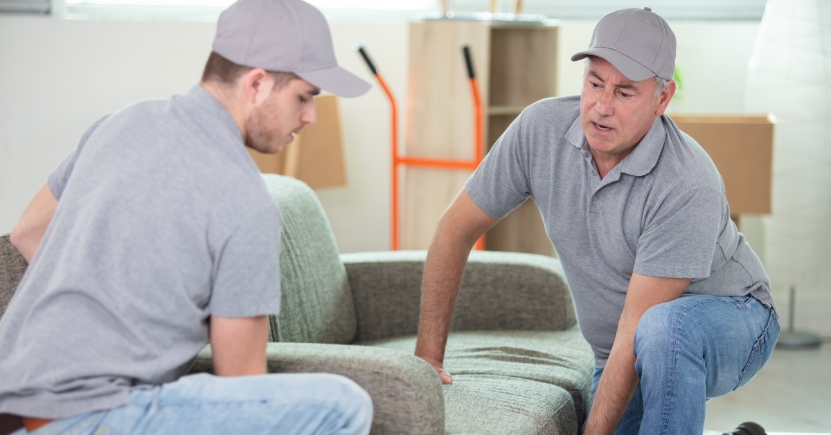 movers carrying a sofa