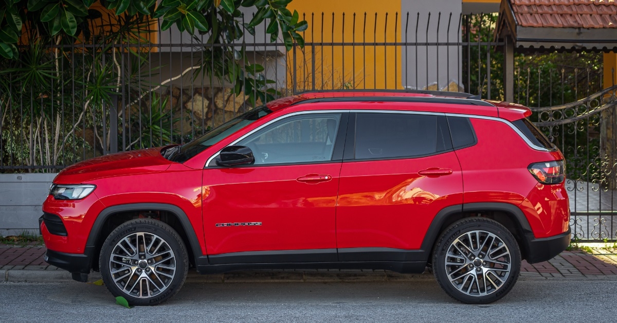 red Jeep Compass parked on street
