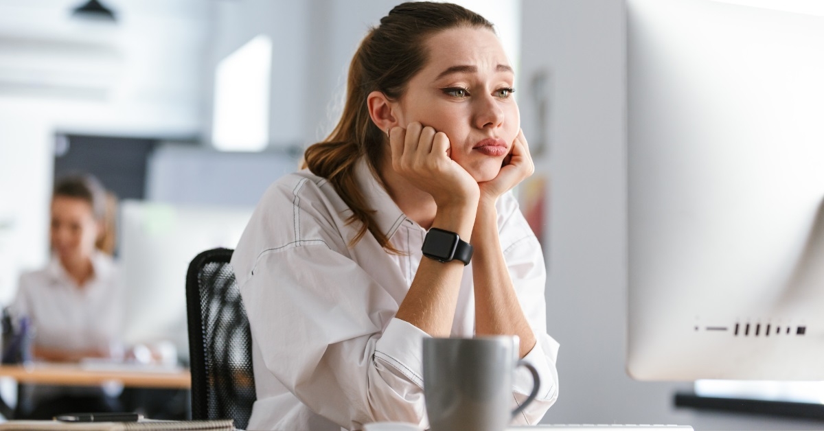 frustrated woman using computer at work