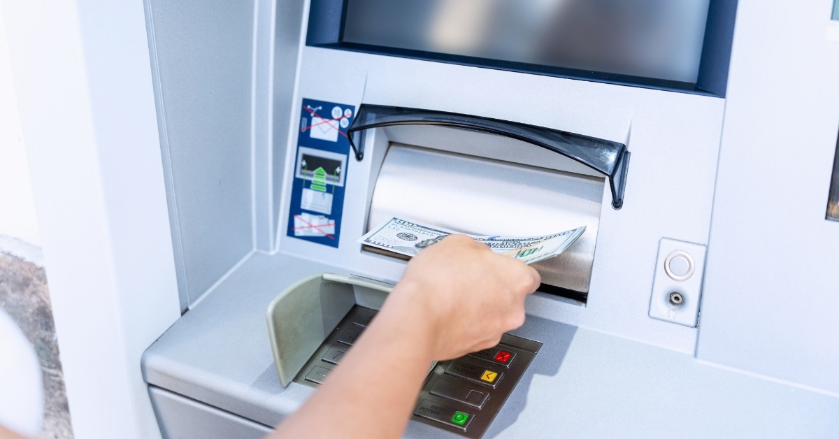 man taking out money from atm