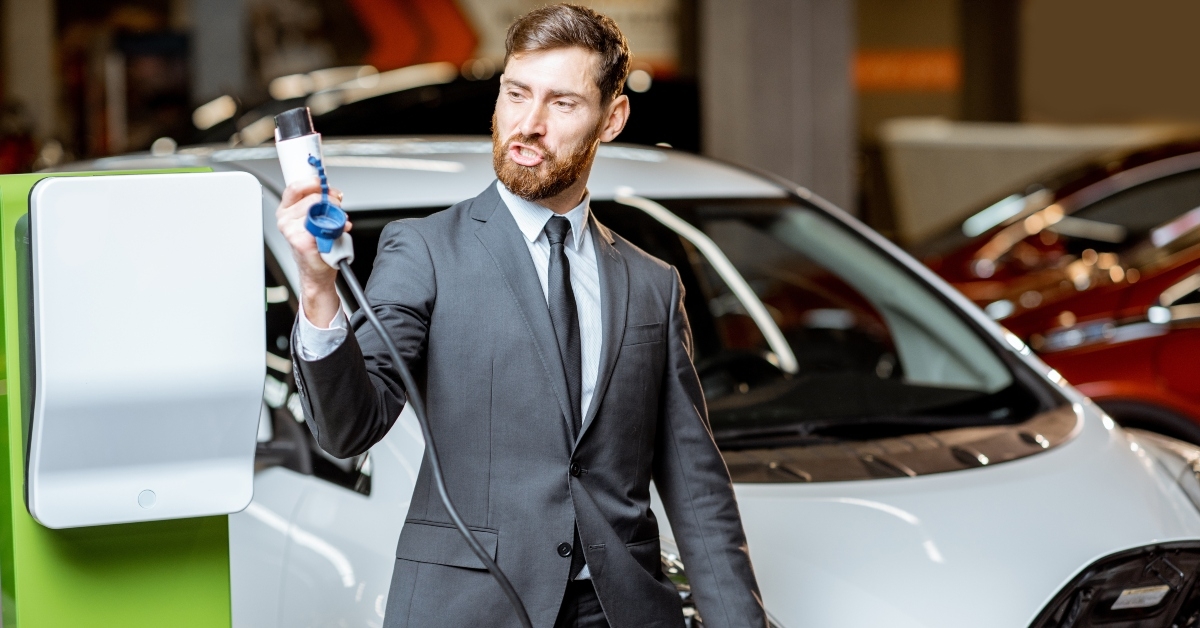 salesman with electric car 