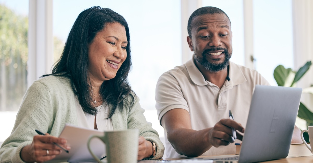 mature african american couple reviewing budget