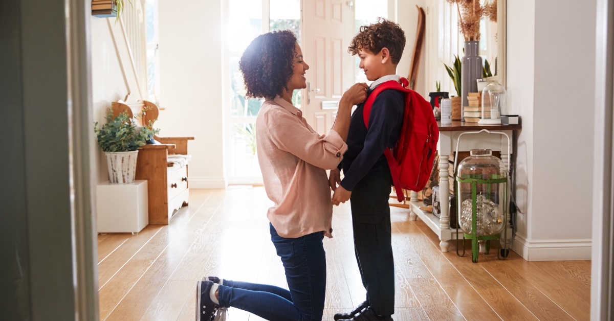 mother preparing son for school