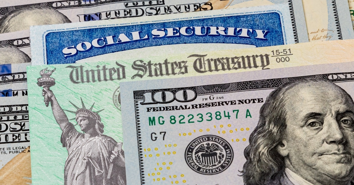 Social Security card besides banknotes