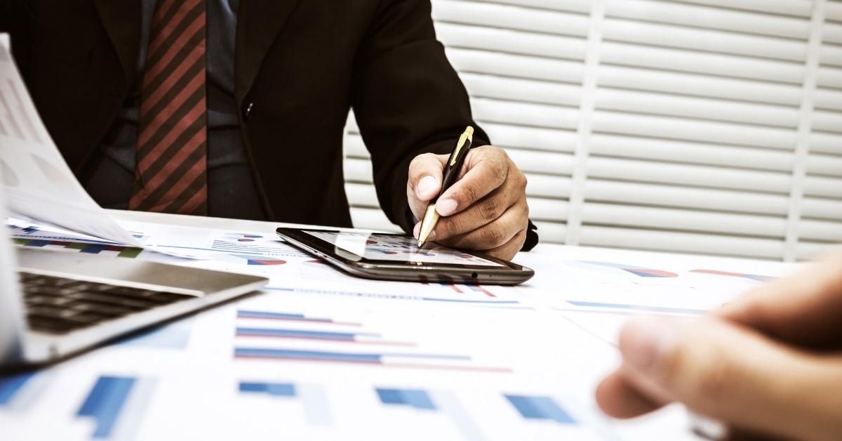 male accountants reviewing data