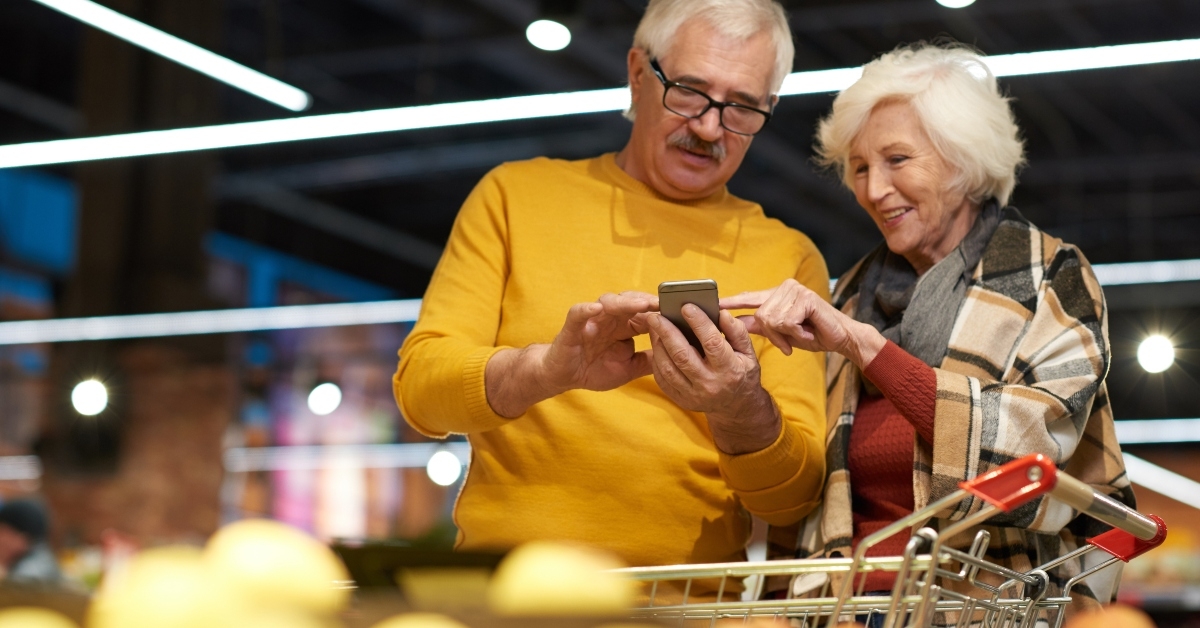 senior couple grocery shopping