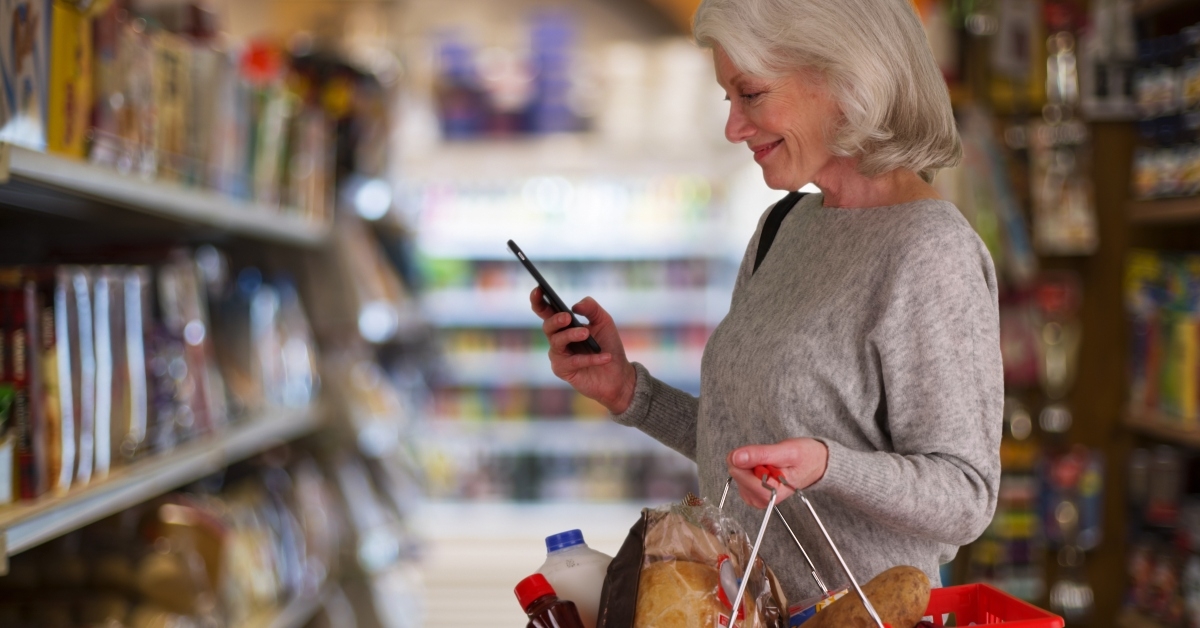 senior woman at grocery aisle