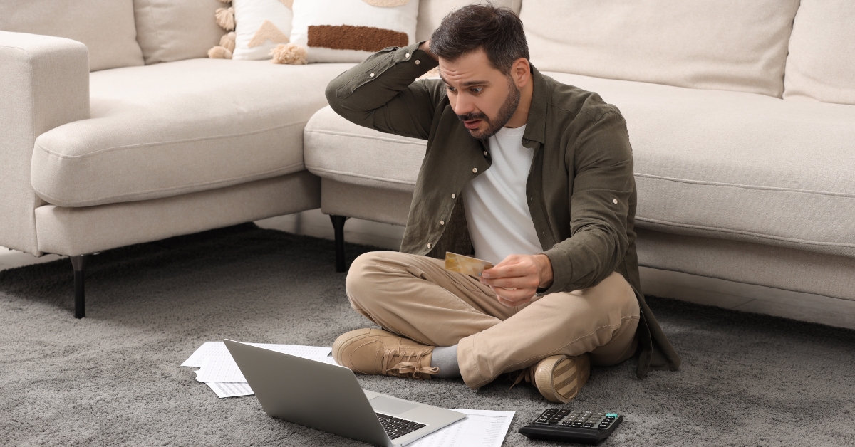 confused man with laptop
