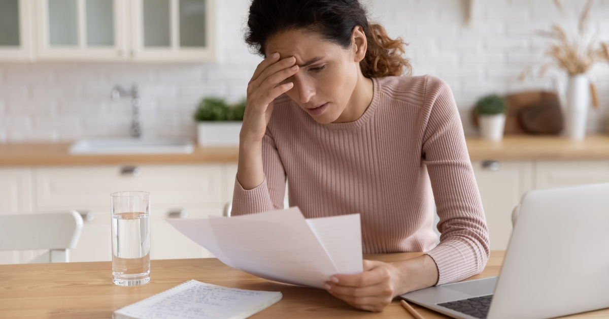 stressed female freelancer scratch forehead