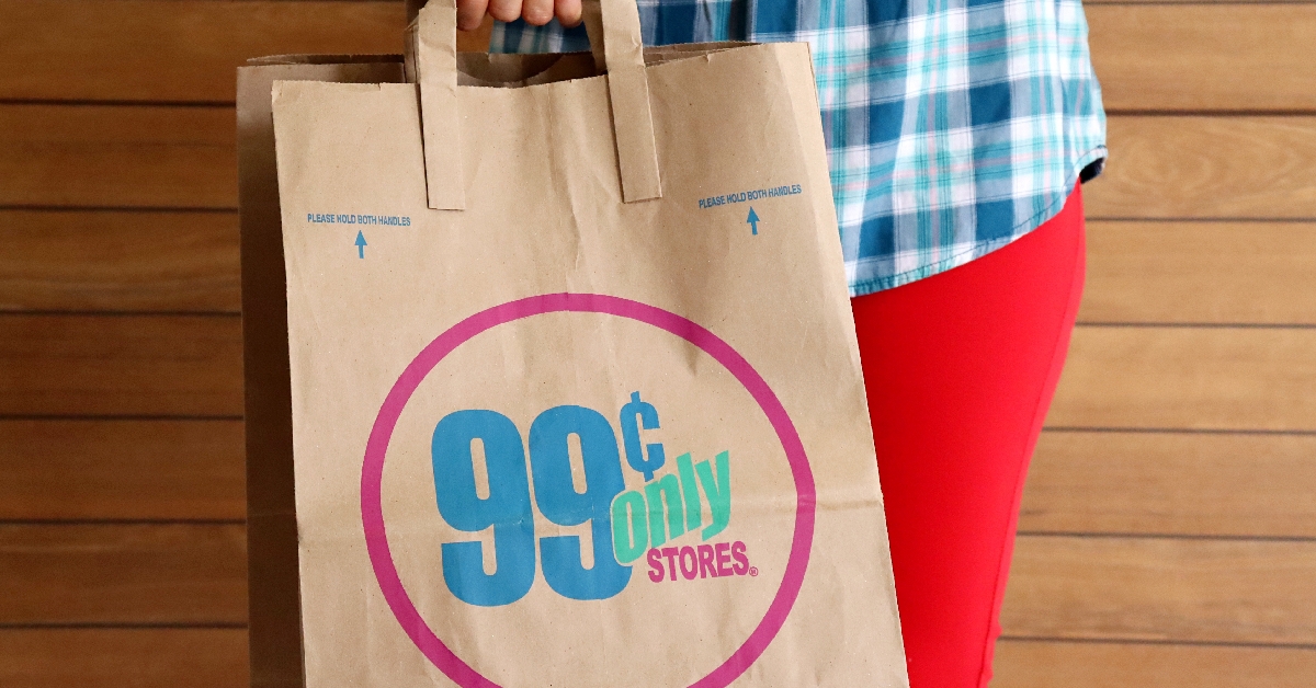 Woman holding 99 Cents Only Stores shopping bag. 