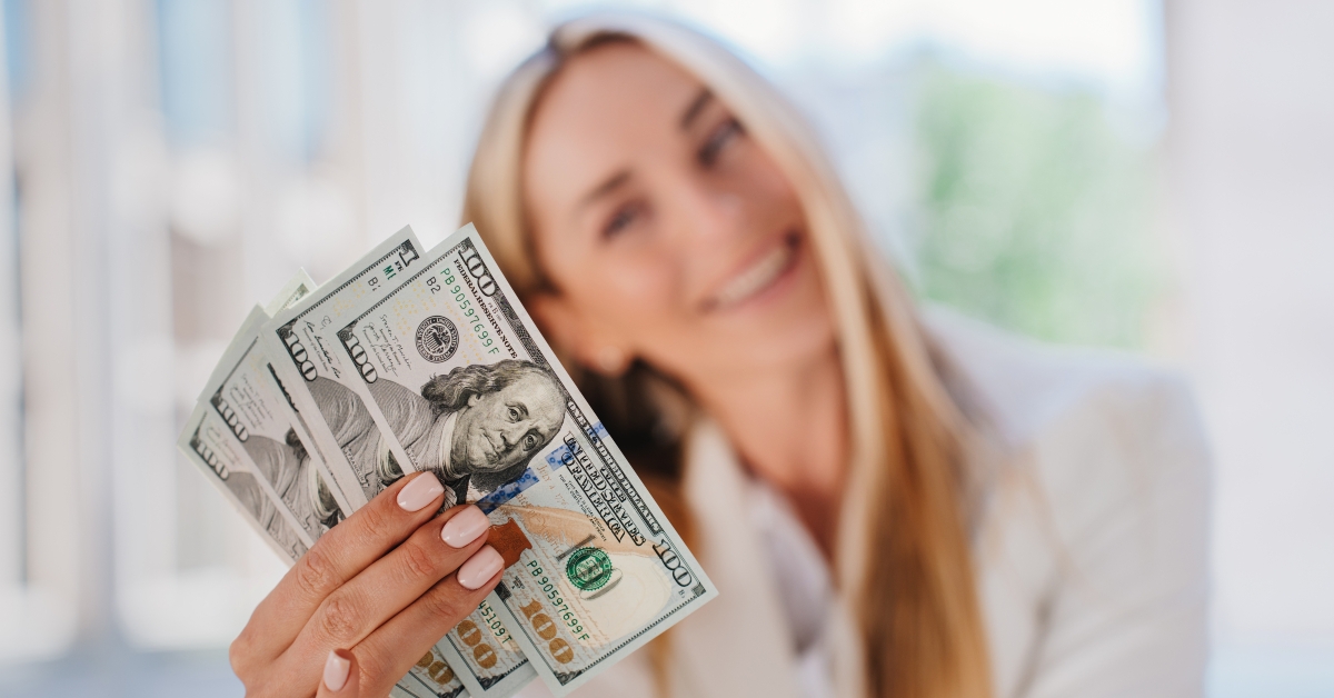 dollar banknotes in hands