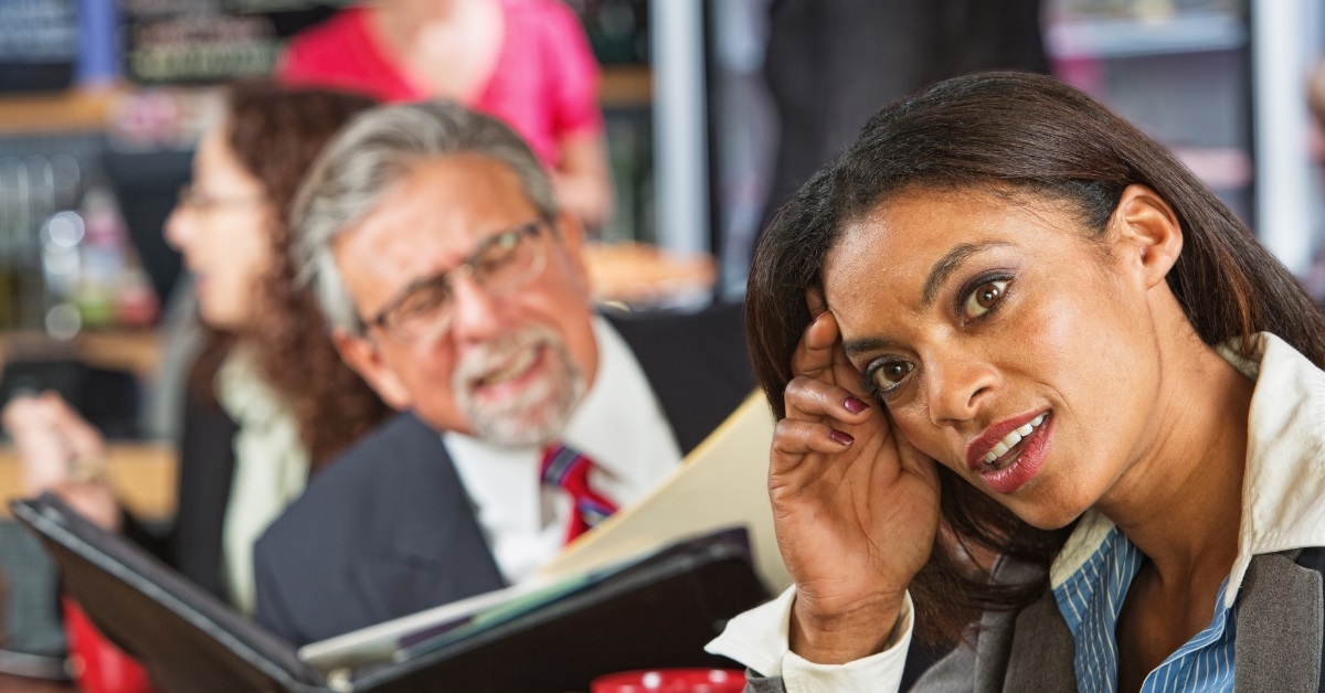 female employee ignoring senior businessman