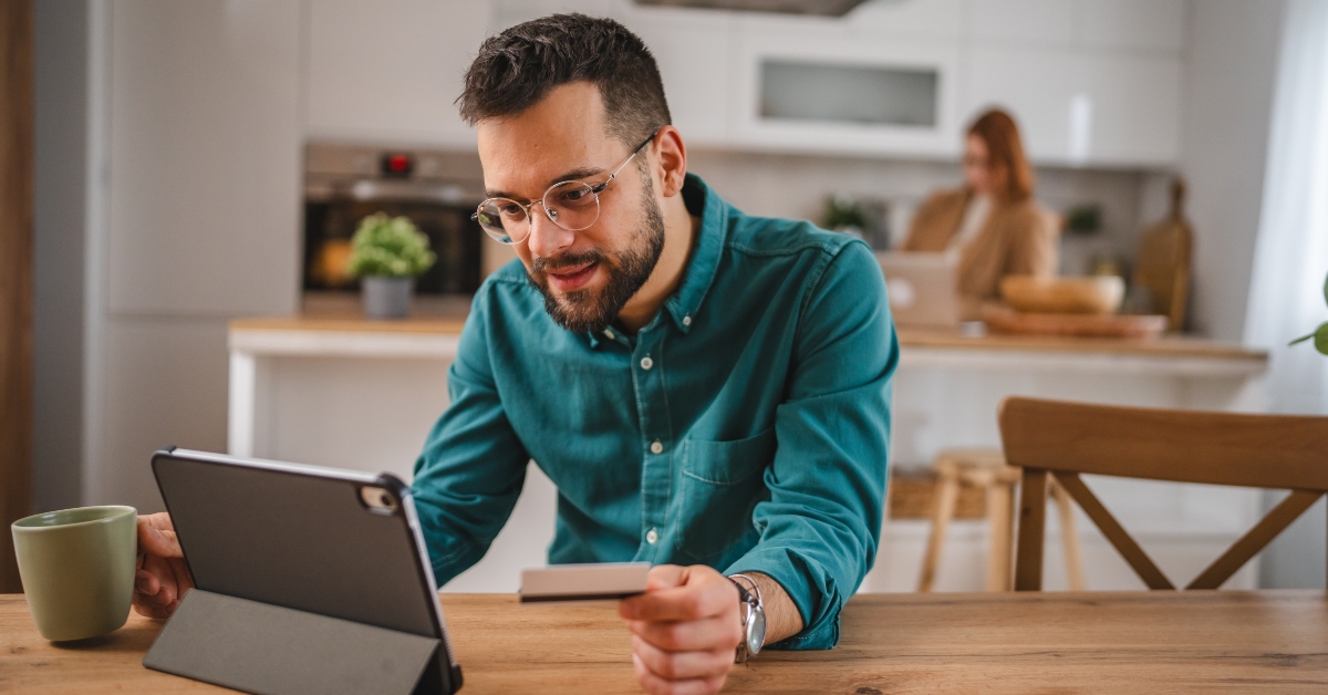 man holds credit card