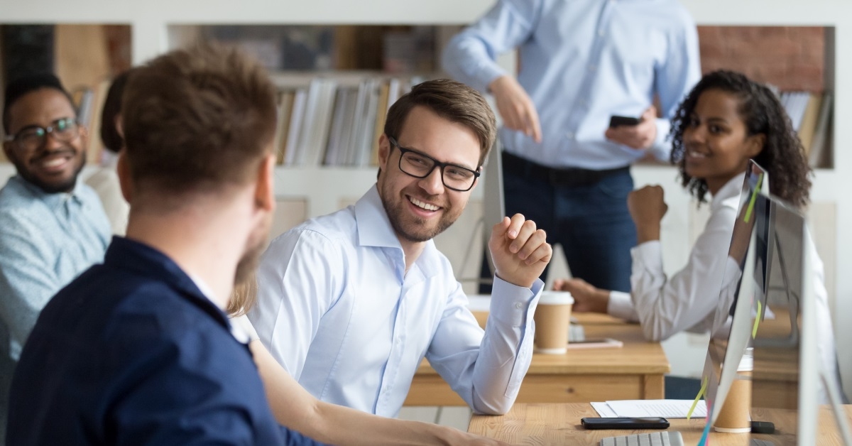multi ethnic colleagues laughing together