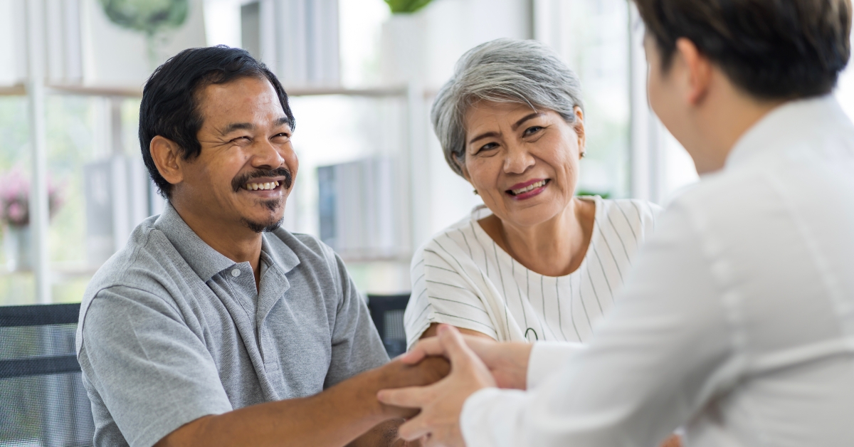seniors talking to insurance staff