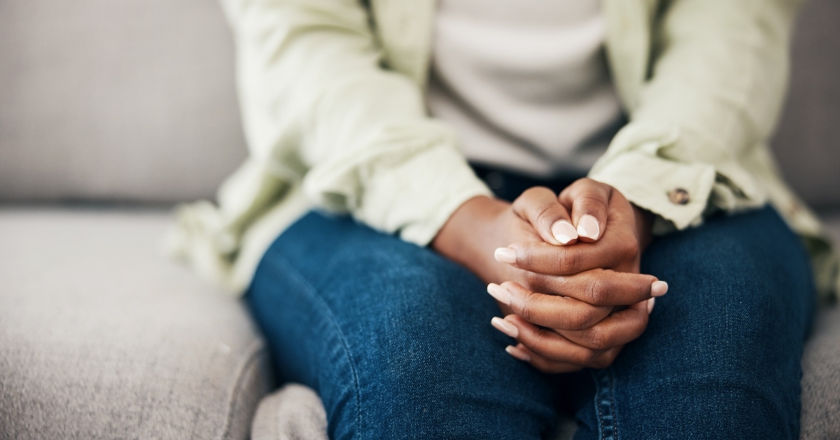 anxious woman on a sofa