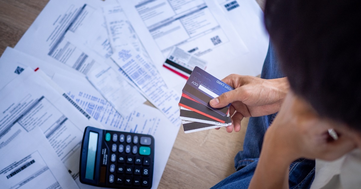 asian man choosing card for payment