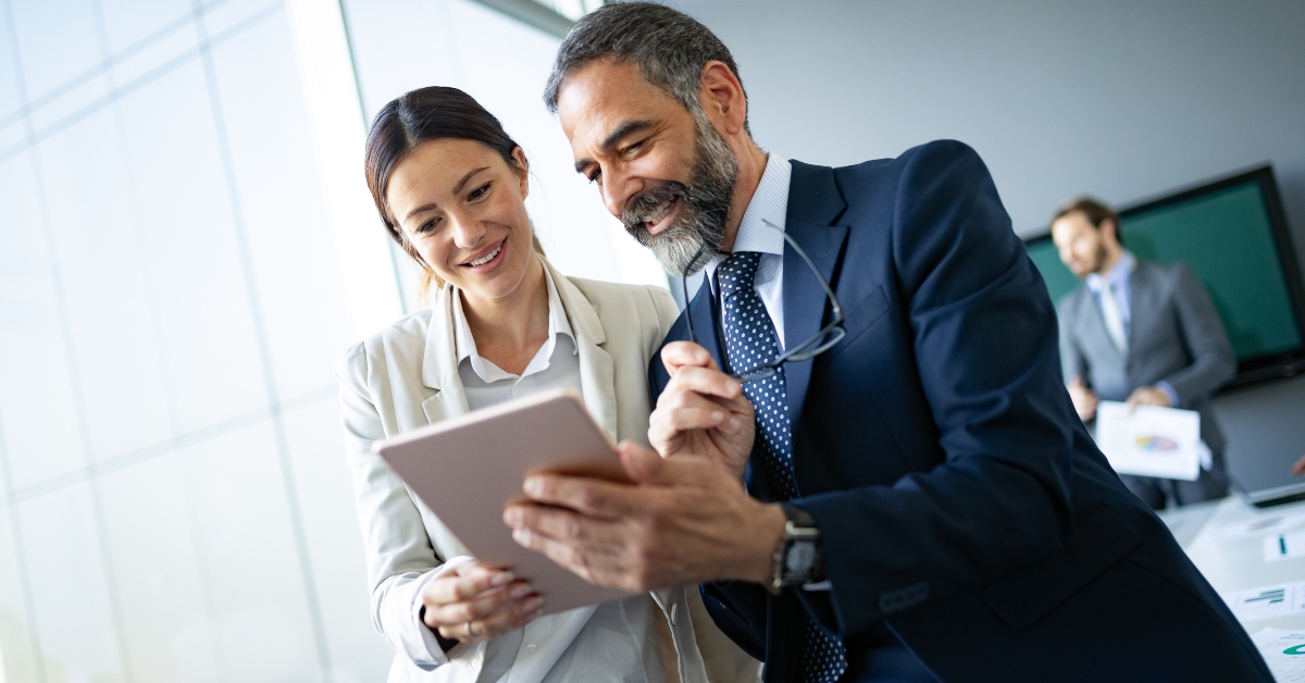 business colleagues using tablet