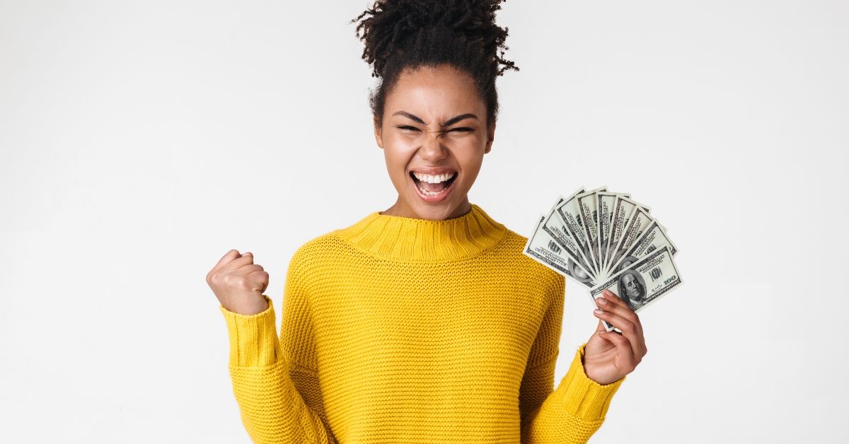 emotional woman holding money