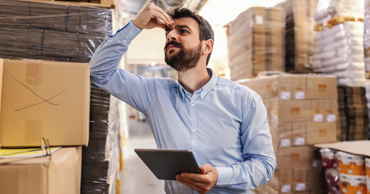 leaning on box in warehouse