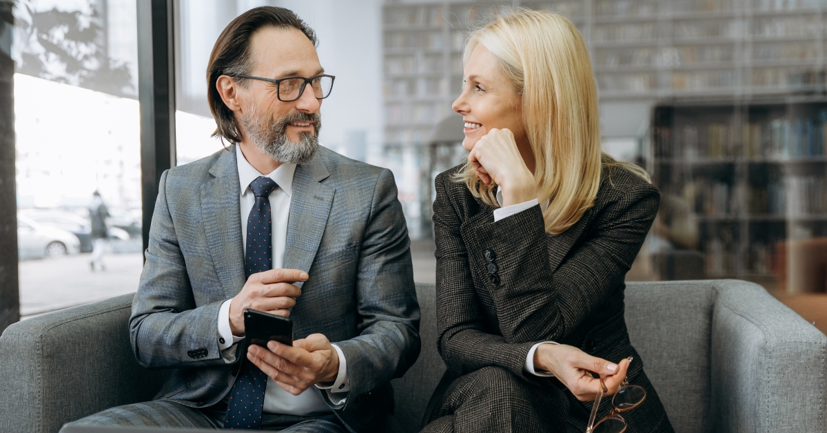 sitting on the sofa in stylish suits