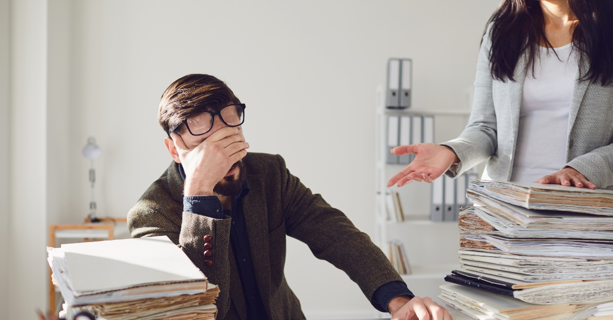 upset businessman sitting at workplace