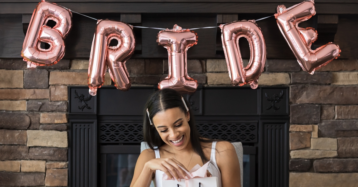 soon to be bride opening a gift