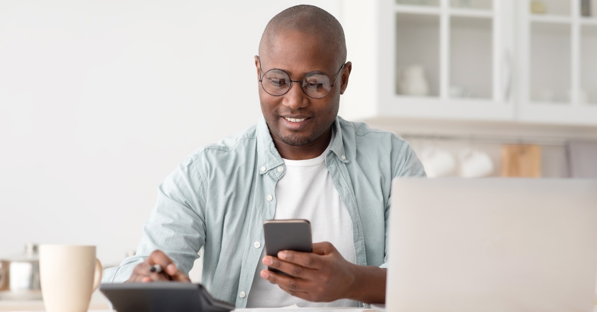 african american man reviewing bills