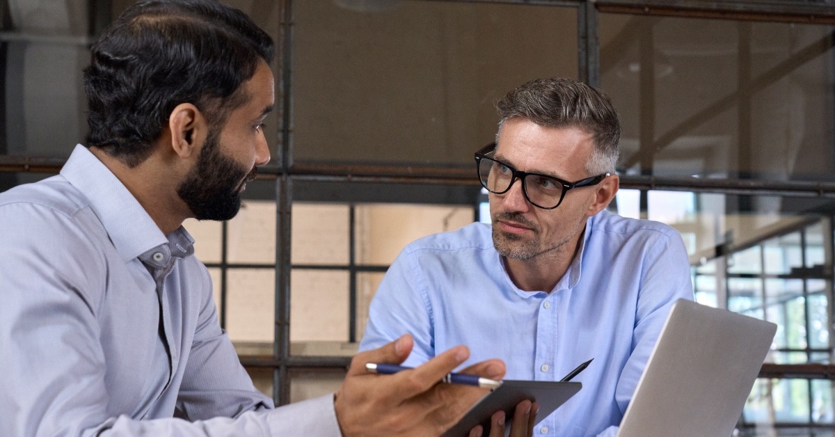 colleagues discussing business market trends