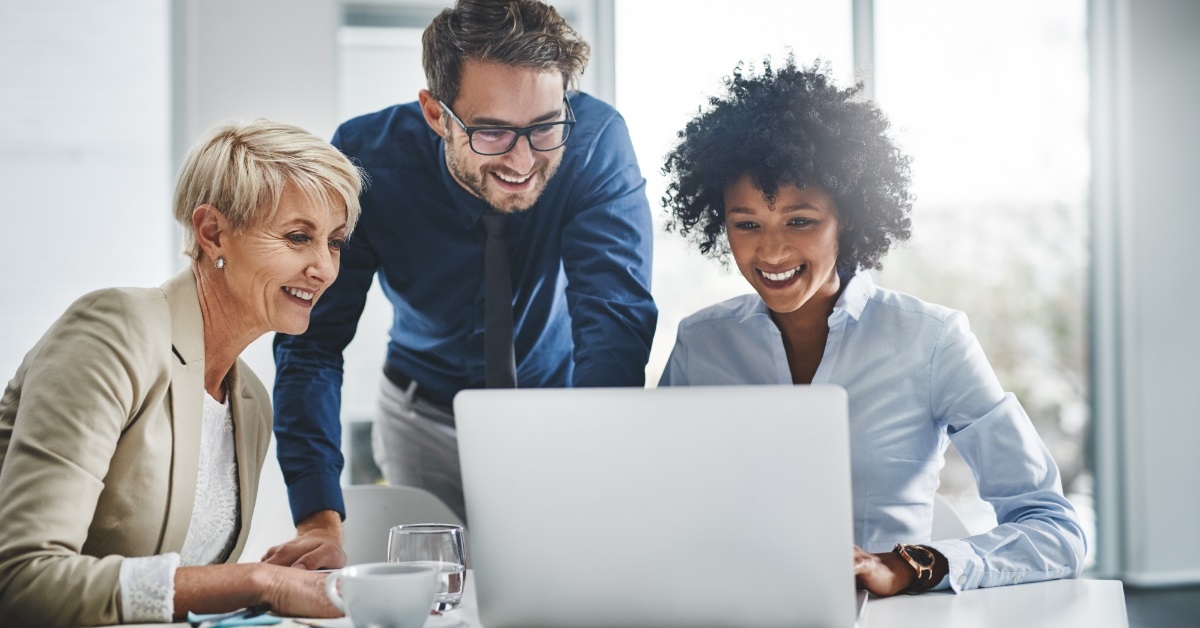 colleagues working on laptop together