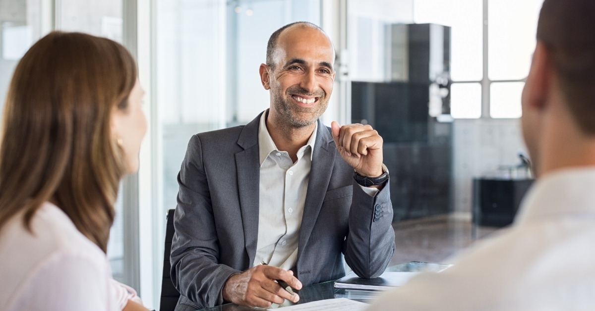 male finance agent advising couple