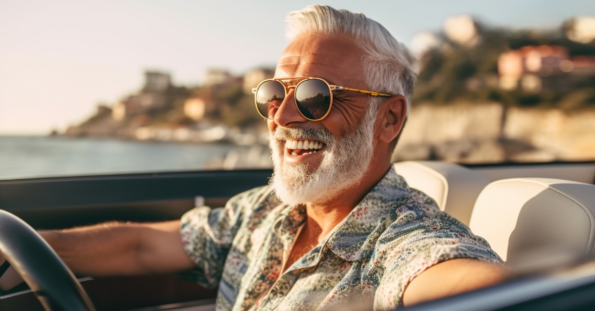 handsome senior man driving in italy
