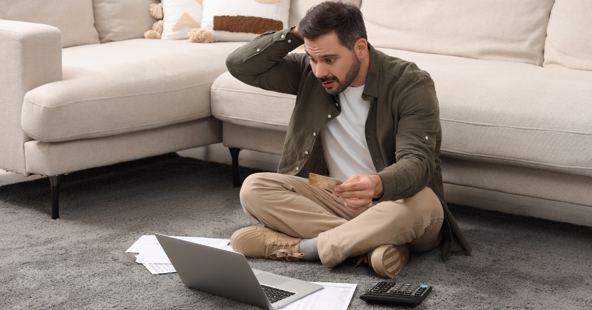 confused man paying bills online