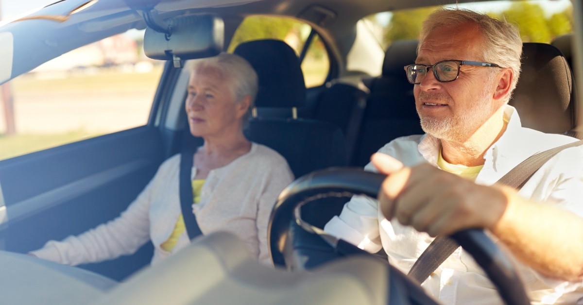 happy senior couple on long drive