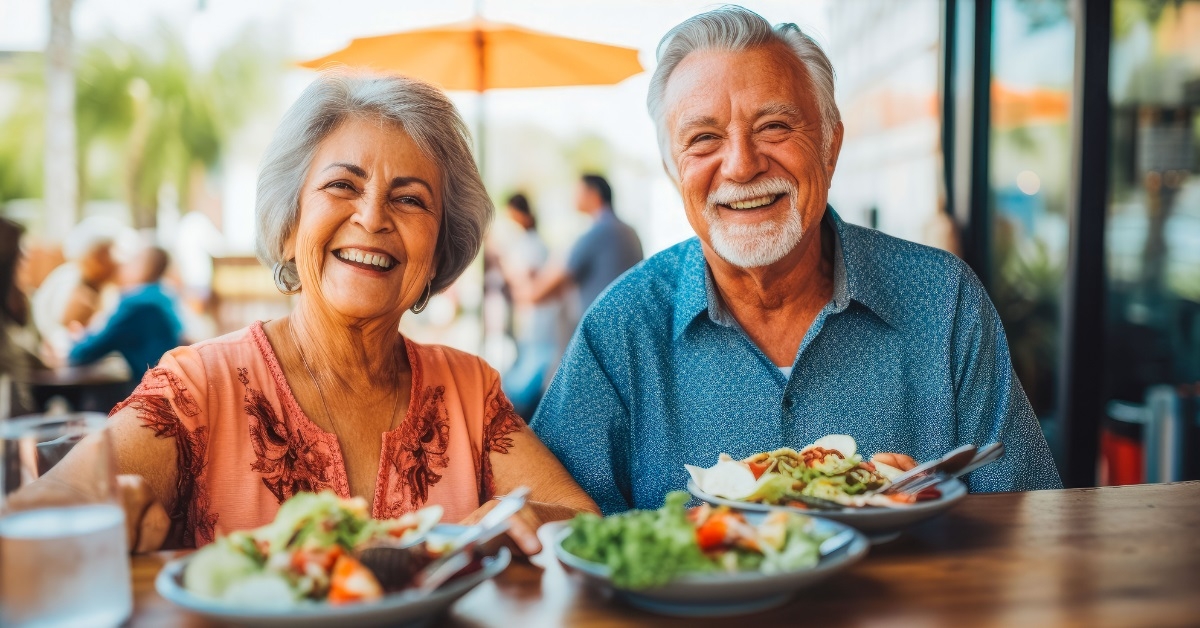 happy senior couple at mexican restaurant