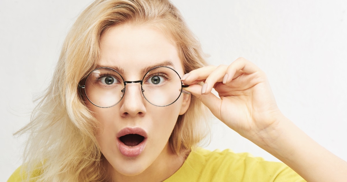blonde woman making surprised face