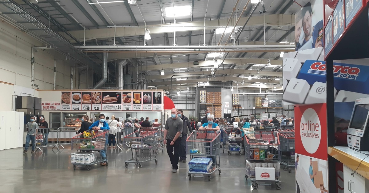 Customers with trolleys at Costco warehouse