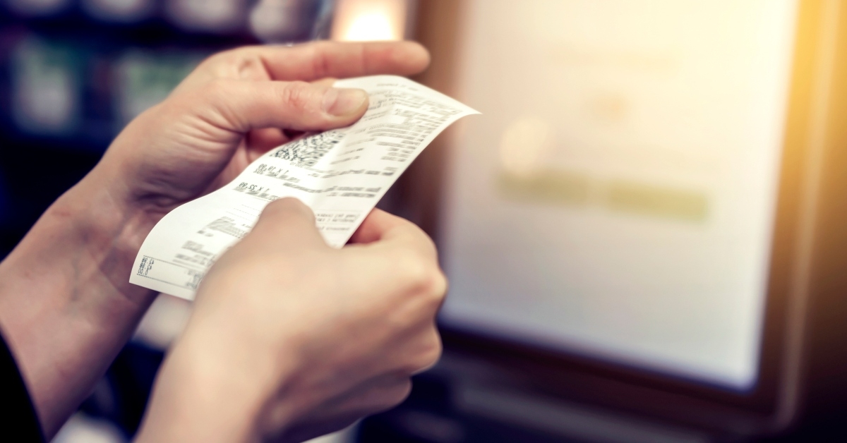 girl looks at the receipt 