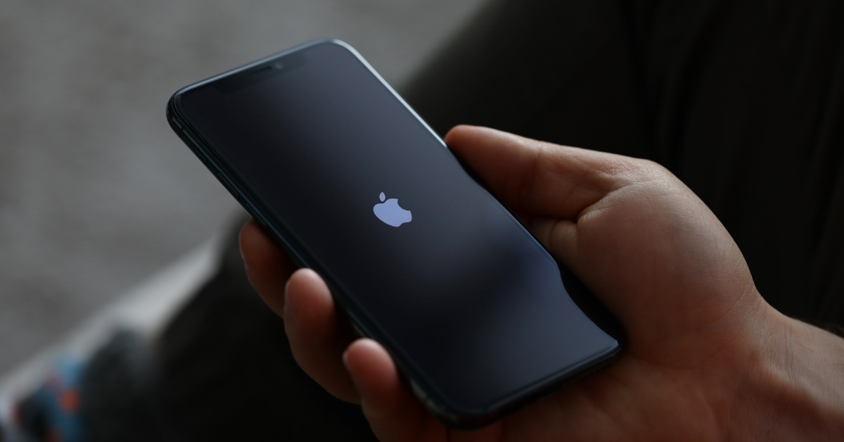 holding apple iphone