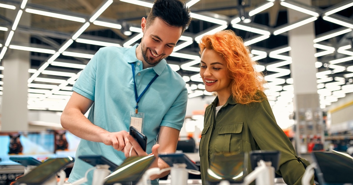 salesman showing Household appliances to client