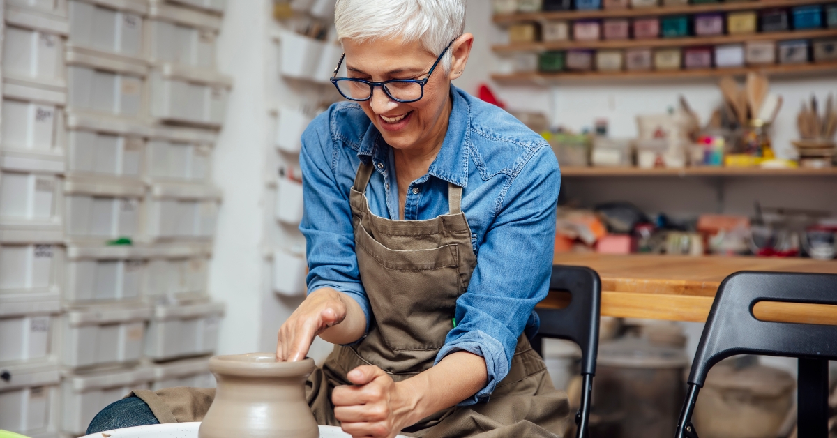 potter working on pottery wheel