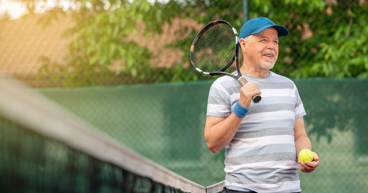 senior man playing tennis