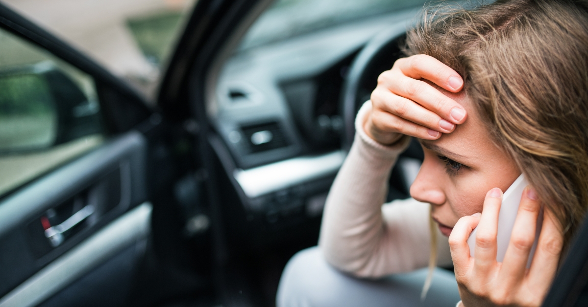 woman in the damaged car