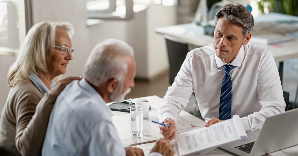couple signing contract with bank manager