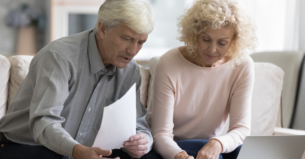 senior couple reviewing bills at home