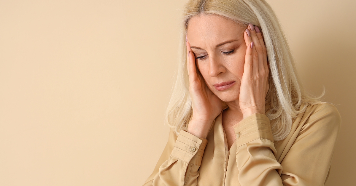 thoughtful woman on beige background