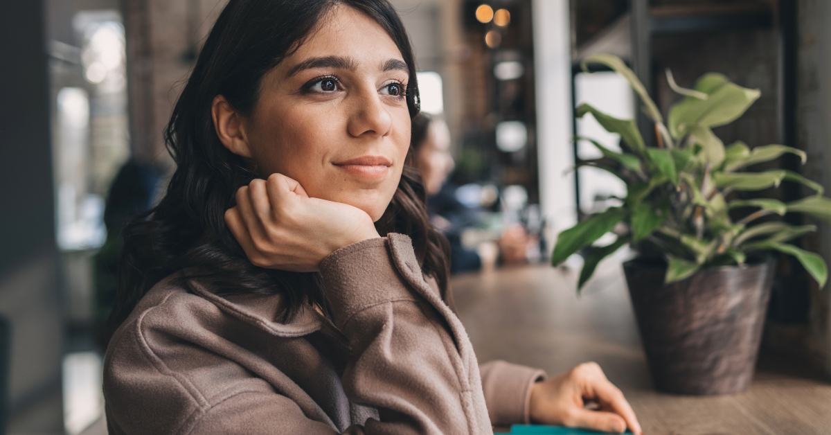 woman makes notes in notebook